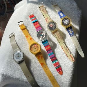 5 swatch watches.  All included